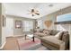 Inviting living room featuring a ceiling fan, an open layout, and lots of natural light at 1094 Paradise Resort Dr, Henderson, NV 89002