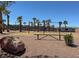 A cheerful playground with swings and benches, inviting fun and recreation for children at 1094 Paradise Resort Dr, Henderson, NV 89002