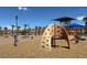Community playground with multiple play structures and safety mulch, perfect for outdoor activities at 1094 Paradise Resort Dr, Henderson, NV 89002