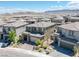 Aerial view of a well-planned community with modern homes, landscaped yards, and mountain views at 12429 Alpenglow Ct, Las Vegas, NV 89138
