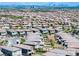 Elevated view of a housing development with community features, neat yards, and city views at 12429 Alpenglow Ct, Las Vegas, NV 89138