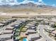 Community aerial showcasing pools, landscaping, and mountain views in a suburban neighborhood at 12429 Alpenglow Ct, Las Vegas, NV 89138