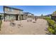 Large backyard area featuring gravel, multiple seating areas, and landscaping at 12429 Alpenglow Ct, Las Vegas, NV 89138