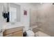 Modern bathroom features a glass shower, neutral tile, and updated vanity at 12429 Alpenglow Ct, Las Vegas, NV 89138