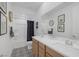 Bathroom featuring a double sink vanity with modern fixtures and patterned tile flooring at 12429 Alpenglow Ct, Las Vegas, NV 89138