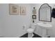 Bathroom featuring white pedestal sink, patterned tile floor, and decorated walls at 12429 Alpenglow Ct, Las Vegas, NV 89138