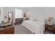 Cozy bedroom with a white bed, neutral carpet, and a bright window at 12429 Alpenglow Ct, Las Vegas, NV 89138