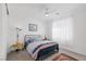 Bright bedroom with neutral carpet, black metal bedframe, and bright window at 12429 Alpenglow Ct, Las Vegas, NV 89138