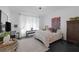 Comfortable bedroom with bright natural light, stylish decor, and ample space for relaxation and personalization at 12429 Alpenglow Ct, Las Vegas, NV 89138