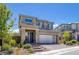 Charming two-story home with a well-maintained front yard, showcasing curb appeal and a welcoming entrance at 12429 Alpenglow Ct, Las Vegas, NV 89138