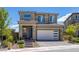 Charming two-story home with a well-kept front yard, paver steps, and a two car garage at 12429 Alpenglow Ct, Las Vegas, NV 89138