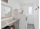 Clean laundry room featuring a stacked washer and dryer and patterned tile flooring at 12429 Alpenglow Ct, Las Vegas, NV 89138