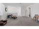 Bright living room with neutral carpet, recessed lighting, and modern decor at 12429 Alpenglow Ct, Las Vegas, NV 89138