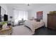 Elegantly decorated main bedroom with a cozy bed, stylish decor, and plenty of natural light at 12429 Alpenglow Ct, Las Vegas, NV 89138