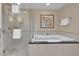 Bathroom showcases a walk-in shower and separate soaking tub at 125 E Harmon Ave # 2907, Las Vegas, NV 89109