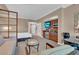 Suite featuring a queen-size bed, a seating area, and a kitchenette for a comfortable and convenient stay at 125 E Harmon Ave # 2907, Las Vegas, NV 89109