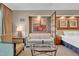 Tastefully decorated bedroom with a comfy couch, stylish glass table, and a large window with natural light at 125 E Harmon Ave # 2907, Las Vegas, NV 89109