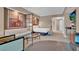 Comfortable living area with a bed, sofa, glass coffee table, and small kitchenette for added convenience at 125 E Harmon Ave # 2907, Las Vegas, NV 89109