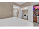 Relaxing bedroom space, featuring closet and wardrobe with mounted TV and compact kitchen at 125 E Harmon Ave # 2907, Las Vegas, NV 89109