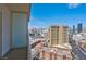 Balcony view of the city with several large buildings and distant mountains at 125 E Harmon Ave # 2907, Las Vegas, NV 89109