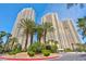 Beautiful high rise buildings with palm trees and lush landscaping in a sunny setting at 125 E Harmon Ave # 2907, Las Vegas, NV 89109