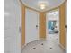 Inviting entryway with white tile flooring and neutral-toned walls, leading into the condo at 125 E Harmon Ave # 2907, Las Vegas, NV 89109