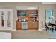 Kitchenette including stainless steel appliances, a microwave, and a small television for a functional and modern space at 125 E Harmon Ave # 2907, Las Vegas, NV 89109