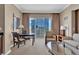 Comfortable condo living area with stylish seating, city views, and dining table at 125 E Harmon Ave # 2907, Las Vegas, NV 89109