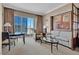 Comfortable condo living area with stylish seating, city views, and dining table at 125 E Harmon Ave # 2907, Las Vegas, NV 89109