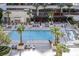 Resort-style pool area featuring cabanas, lounge chairs, and lush landscaping for relaxation at 125 E Harmon Ave # 2907, Las Vegas, NV 89109