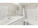 Bright bathroom with white cabinets, a large mirror, and shower at 160 Lomita Heights Dr, Las Vegas, NV 89138