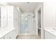 Clean bathroom featuring double sinks, ample storage, and a spacious tiled shower at 160 Lomita Heights Dr, Las Vegas, NV 89138