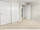 Bedroom featuring wall closet, carpet, and access to the ensuite bathroom at 160 Lomita Heights Dr, Las Vegas, NV 89138