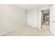 Neutrally decorated bedroom with carpet and sliding closet doors at 160 Lomita Heights Dr, Las Vegas, NV 89138