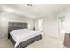 Neutral bedroom featuring a stylish gray upholstered headboard and a spacious layout at 160 Lomita Heights Dr, Las Vegas, NV 89138