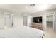Spacious bedroom features ensuite bathroom, walk-in closet, and neutral walls and flooring at 160 Lomita Heights Dr, Las Vegas, NV 89138