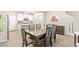 Open dining room showcasing the table and chairs, flowing into a modern kitchen at 160 Lomita Heights Dr, Las Vegas, NV 89138