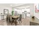 Dining room with a view of the bright, white kitchen, great for entertaining at 160 Lomita Heights Dr, Las Vegas, NV 89138