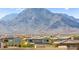 Community view featuring picturesque mountains and houses with rooftop solar panels at 160 Lomita Heights Dr, Las Vegas, NV 89138