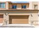 View of the two-car garage of the exterior of a townhome at 160 Lomita Heights Dr, Las Vegas, NV 89138