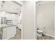 Hallway view of a kitchen and powder room at 160 Lomita Heights Dr, Las Vegas, NV 89138