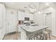 Kitchen island with granite countertops, modern lighting, and bar stool seating at 160 Lomita Heights Dr, Las Vegas, NV 89138