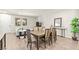 Open-concept living and dining area with a large dining table and view of the living room at 160 Lomita Heights Dr, Las Vegas, NV 89138
