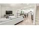 Spacious living area with an open floor plan, modern furnishings, and seamlessly connected to the kitchen at 160 Lomita Heights Dr, Las Vegas, NV 89138