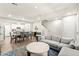 Open-concept living space with modern decor, wood floors, kitchen, and plenty of natural light at 160 Lomita Heights Dr, Las Vegas, NV 89138