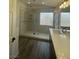 Bathroom features walk-in shower with a double sink vanity at 1785 Puerto Way, Henderson, NV 89012