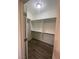 Empty closet boasts hardwood floors and multiple shelves at 1785 Puerto Way, Henderson, NV 89012