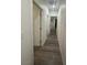 Hallway showcases hardwood floors and white walls with white doors at 1785 Puerto Way, Henderson, NV 89012