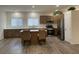 Modern kitchen featuring stainless steel appliances, quartz countertops, ample cabinetry, and a center island at 1785 Puerto Way, Henderson, NV 89012