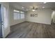 Bright, spacious living room with new luxury vinyl plank floors, neutral paint and recessed lighting at 1785 Puerto Way, Henderson, NV 89012